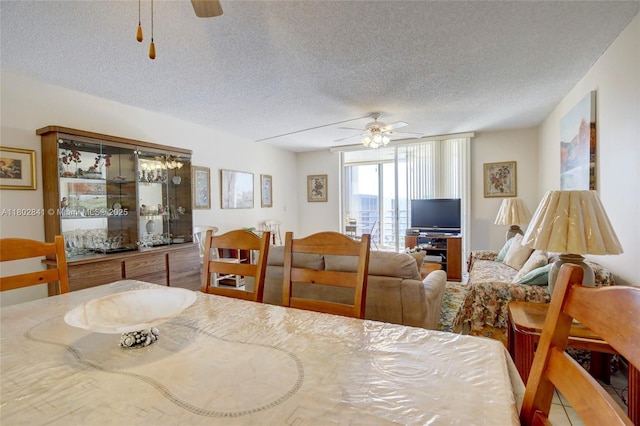 424 SE 10th St Unit 405, Dania Beach, FL 33004 - dining space featuring a ceiling fan and a textured ceiling