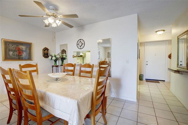 424 SE 10th St Unit 405, Dania Beach, FL 33004 - dining area featuring a ceiling fan, light tile patterned flooring, and a textured ceiling