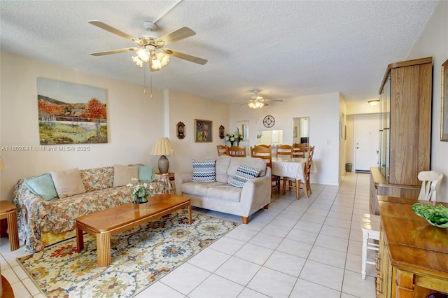 424 SE 10th St Unit 405, Dania Beach, FL 33004 - living room featuring ceiling fan, a textured ceiling, and light tile patterned flooring