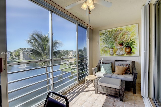 424 SE 10th St Unit 405, Dania Beach, FL 33004 - sunroom featuring tile patterned floors, healthy amount of natural light, and a water view
