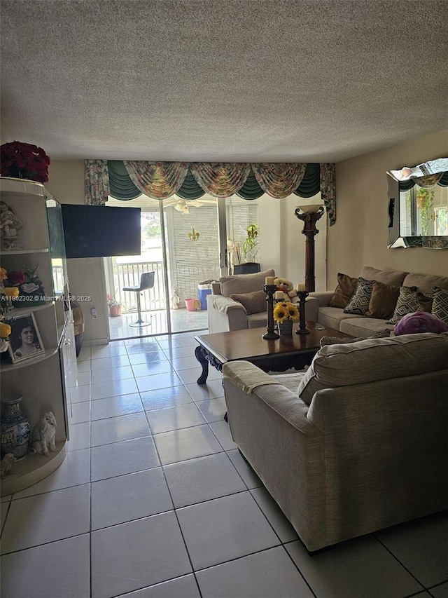 1670 NE 191st St Unit 109-3, Miami, FL 33179 - living area with healthy amount of natural light, light tile patterned floors, and a textured ceiling