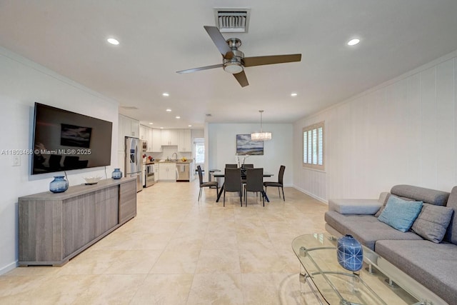 932 Polk St, Hollywood, FL 33019 - living area with recessed lighting, a ceiling fan, baseboards, ornamental molding, and light tile patterned floors