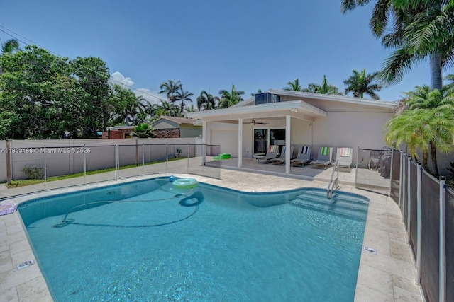 932 Polk St, Hollywood, FL 33019 - view of swimming pool featuring a ceiling fan, fence, and a patio area