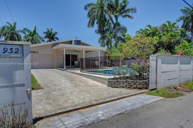 932 Polk St, Hollywood, FL 33019 - gate with a ceiling fan and fence
