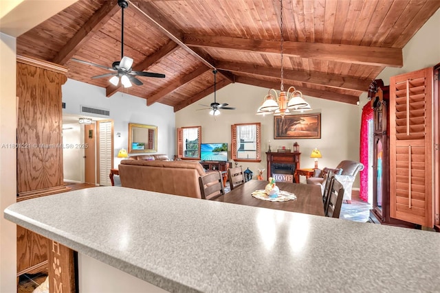 kitchen with wood ceiling, a ceiling fan, decorative light fixtures, open floor plan, and a fireplace