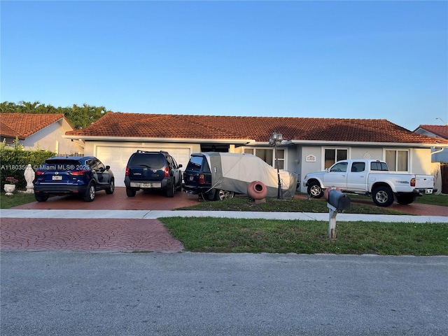 1900 SW 141st Ave, Miami, FL 33175 - single story home with a garage, decorative driveway, and a tiled roof