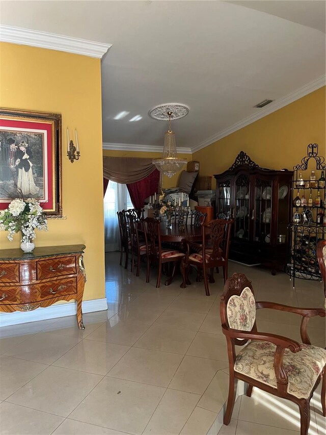 1900 SW 141st Ave, Miami, FL 33175 - dining area with crown molding, a chandelier, tile patterned floors, and baseboards