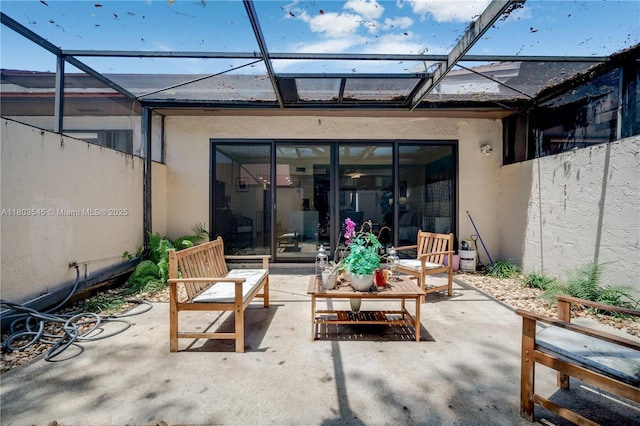 13370 SW 89th Ter Unit E, Miami, FL 33186 - rear view of house featuring stucco siding, a patio, and a lanai