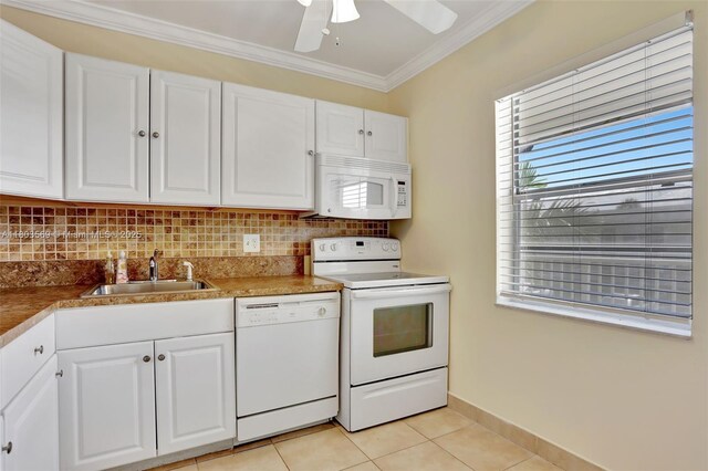 551 NW 80th Ter Unit 203, Margate, FL 33063 - kitchen featuring white appliances, decorative backsplash, crown molding, and white cabinetry