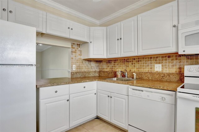 551 NW 80th Ter Unit 203, Margate, FL 33063 - kitchen with white appliances, a sink, crown molding, white cabinets, and backsplash