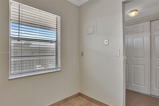 551 NW 80th Ter Unit 203, Margate, FL 33063 - spare room with light tile patterned flooring and baseboards