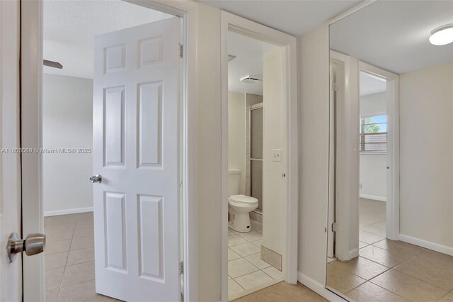 551 NW 80th Ter Unit 203, Margate, FL 33063 - full bath with tile patterned floors, toilet, and baseboards
