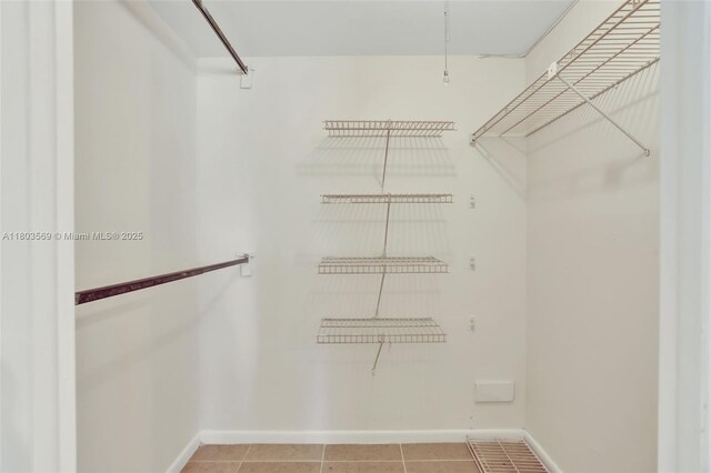 551 NW 80th Ter Unit 203, Margate, FL 33063 - walk in closet featuring tile patterned floors