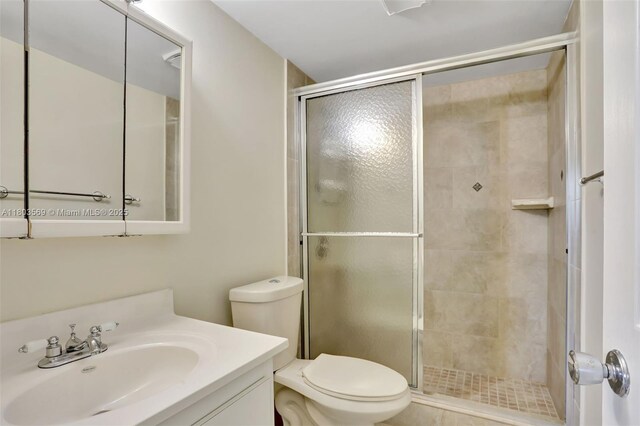 551 NW 80th Ter Unit 203, Margate, FL 33063 - bathroom with a shower stall, toilet, and vanity