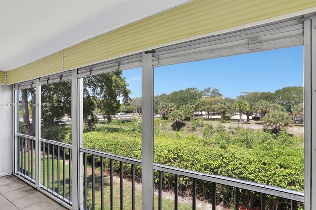 551 NW 80th Ter Unit 203, Margate, FL 33063 - unfurnished sunroom with view of scattered trees