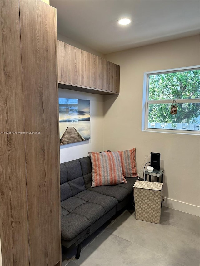 9224 Byron Ave, Surfside, FL 33154 - living area featuring baseboards, concrete floors, and recessed lighting