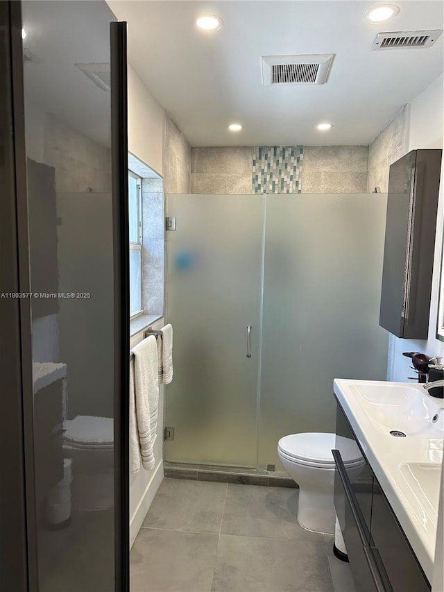 9224 Byron Ave, Surfside, FL 33154 - full bathroom with toilet, a shower stall, double vanity, and recessed lighting