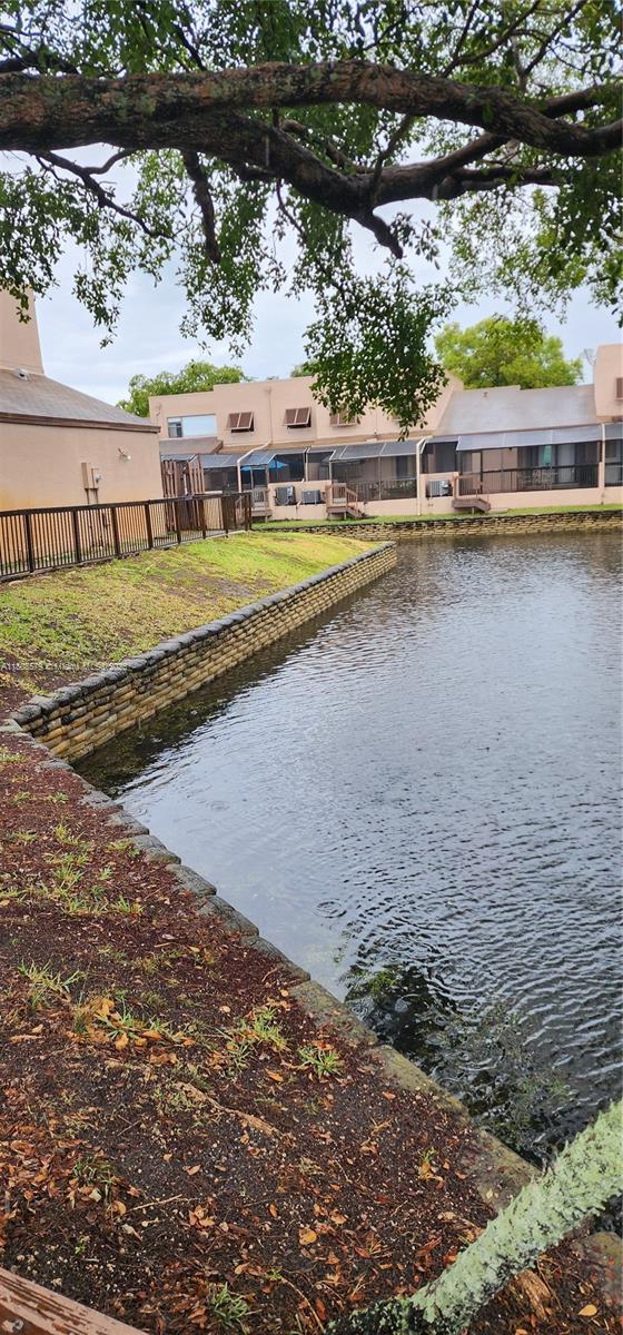 water view featuring fence