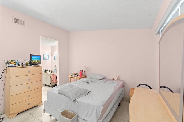 9641 Riverside Dr Unit F6, Coral Springs, FL 33071 - bedroom featuring light tile patterned floors and connected bathroom
