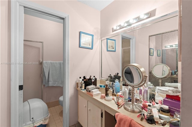 9641 Riverside Dr Unit F6, Coral Springs, FL 33071 - bathroom featuring toilet, a stall shower, vanity, and tile patterned flooring