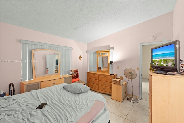 9641 Riverside Dr Unit F6, Coral Springs, FL 33071 - bedroom with vaulted ceiling, light tile patterned floors, and a textured ceiling