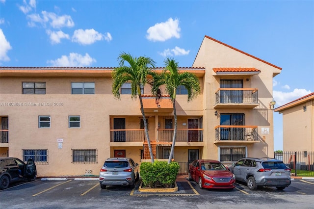 5530 W 26th Ct Unit 209, Hialeah, FL 33016 - view of apartment building / complex featuring uncovered parking