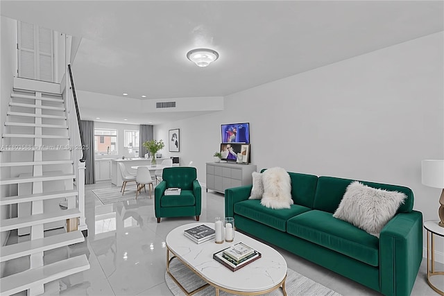5530 W 26th Ct Unit 209, Hialeah, FL 33016 - living room with light marble finish floors, stairway, and recessed lighting
