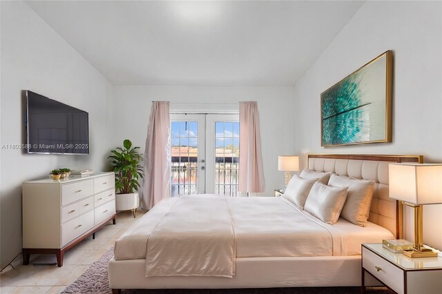 5530 W 26th Ct Unit 209, Hialeah, FL 33016 - bedroom featuring access to outside, french doors, and light tile patterned floors