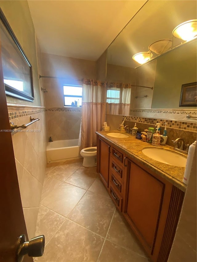 2180 SW 115th Ter, Davie, FL 33325 - full bath with tile patterned flooring, toilet, shower / bath combination with curtain, tile walls, and double vanity