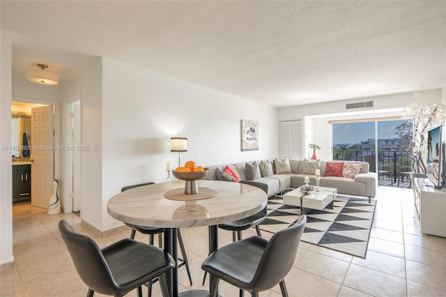 1625 SE 10th Ave Unit 607, Fort Lauderdale, FL 33316 - dining room with light tile patterned flooring and a textured ceiling