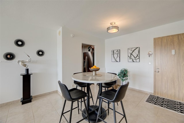 1625 SE 10th Ave Unit 607, Fort Lauderdale, FL 33316 - dining space with light tile patterned flooring and baseboards