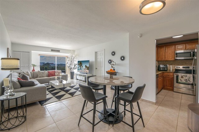 1625 SE 10th Ave Unit 607, Fort Lauderdale, FL 33316 - dining area with light tile patterned flooring