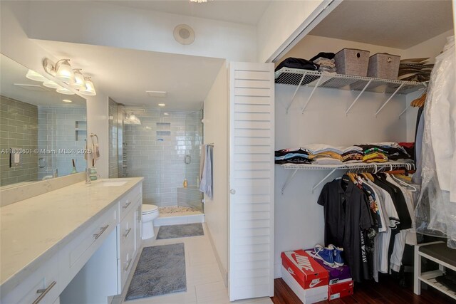 1625 SE 10th Ave Unit 607, Fort Lauderdale, FL 33316 - full bathroom with vanity, a stall shower, a spacious closet, and toilet