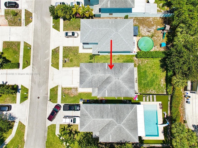 drone / aerial view of a pool