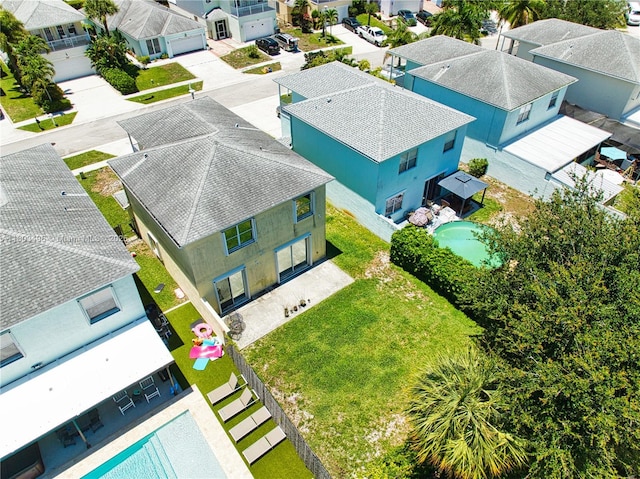 aerial view of residential area with a pool