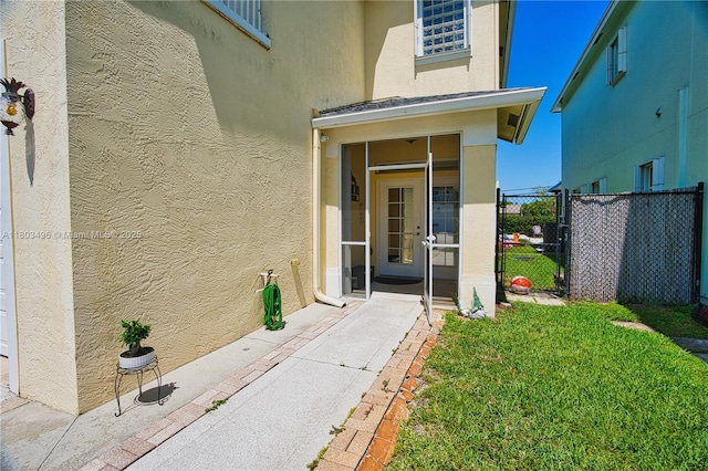 doorway to property with stucco siding