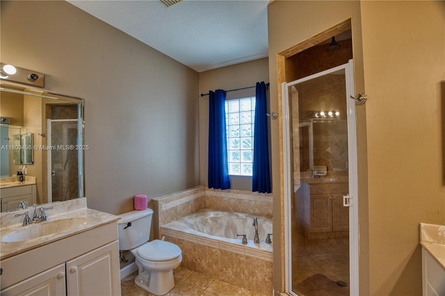 bathroom with a stall shower, a bath, vanity, tile patterned floors, and toilet