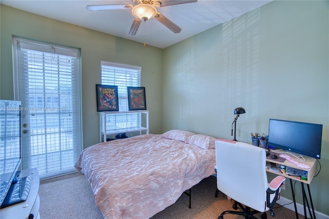 carpeted bedroom with a ceiling fan