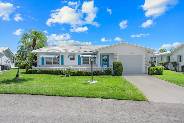 1897 SW 20th Cir, Boynton Beach, FL 33426 - ranch-style house with a tile roof, an attached garage, driveway, a front yard, and stucco siding