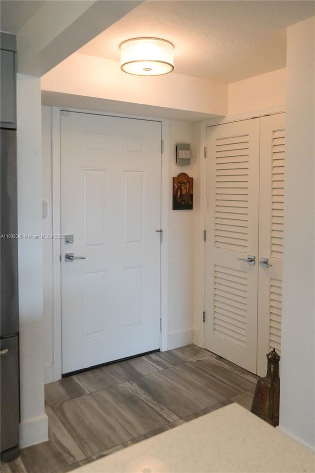 401 SE 3rd St Unit 403, Dania Beach, FL 33004 - foyer entrance featuring wood finished floors and baseboards