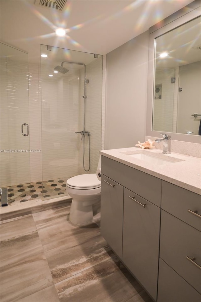 401 SE 3rd St Unit 403, Dania Beach, FL 33004 - bathroom with a shower stall, vanity, and toilet
