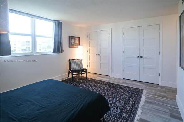 401 SE 3rd St Unit 403, Dania Beach, FL 33004 - bedroom featuring baseboards and wood finished floors