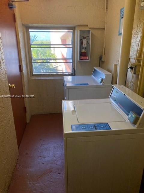 401 SE 3rd St Unit 403, Dania Beach, FL 33004 - washroom featuring washer and dryer