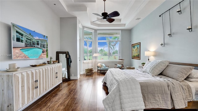 2495 Eagle Watch Ln, Weston, FL 33327 - bedroom with wood-type flooring, a raised ceiling, baseboards, and ceiling fan