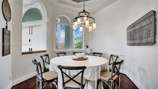 2495 Eagle Watch Ln, Weston, FL 33327 - dining room featuring baseboards, dark wood finished floors, a chandelier, and a tray ceiling