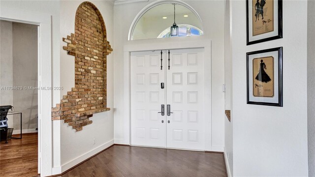 2495 Eagle Watch Ln, Weston, FL 33327 - foyer entrance with dark wood finished floors and baseboards