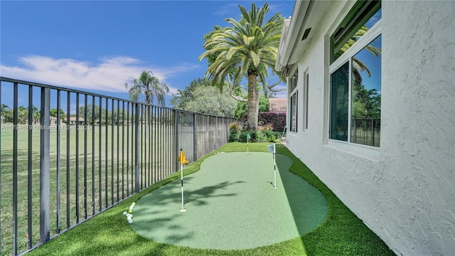 2495 Eagle Watch Ln, Weston, FL 33327 - view of yard with an area to practice putting and fence
