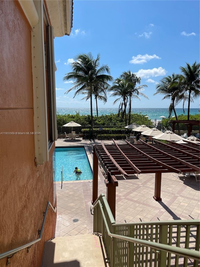 2080 S Ocean Dr Unit Ph4, Hallandale Beach, FL 33009 - community pool featuring a water view and a patio area