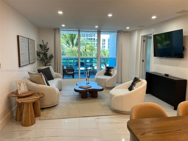 2301 Collins Ave Unit 326, Miami Beach, FL 33139 - living room with recessed lighting, light marble finish flooring, and floor to ceiling windows