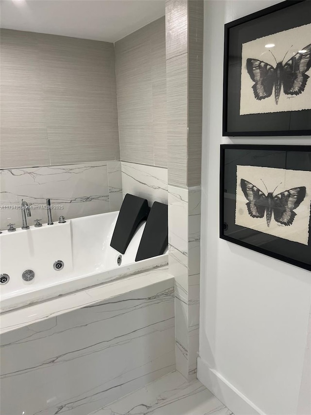 2301 Collins Ave Unit 326, Miami Beach, FL 33139 - bathroom with marble finish floors and a tub with jets